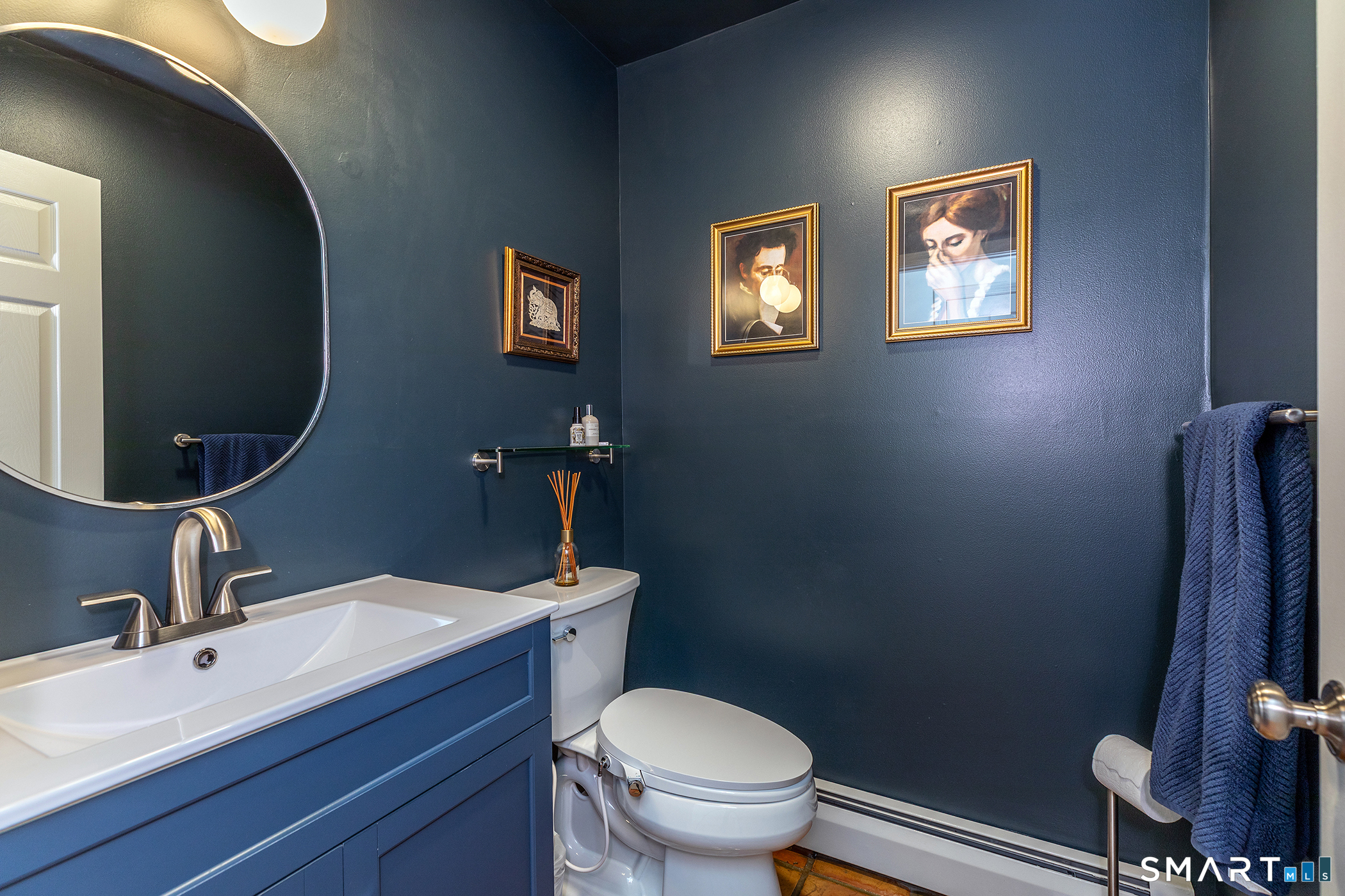 12 Silver Hill Road Sharon, CT 06069 - Photo 12 of 26 a bathroom with a toilet a sink and mirror
