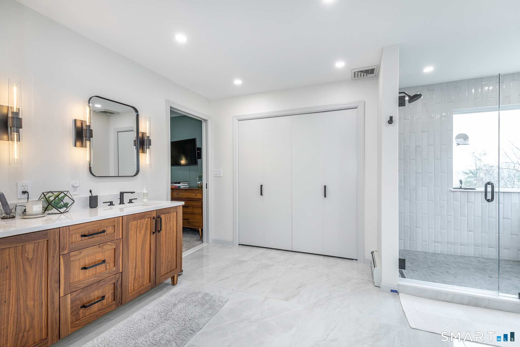 12 Silver Hill Road Sharon, CT 06069 - Photo 15 of 26 a bathroom with a double vanity sink mirror double and shower