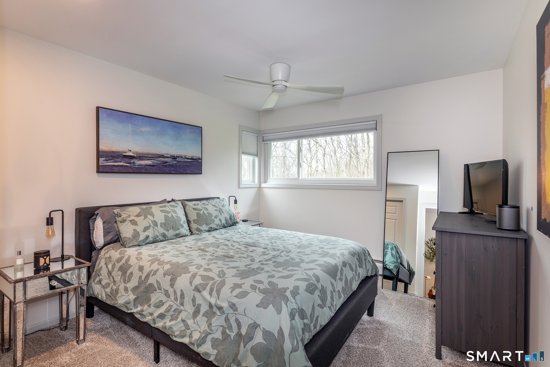 12 Silver Hill Road Sharon, CT 06069 - Photo 17 of 26 a bedroom with a bed bathroom with a flat tv screen and a walk in closet