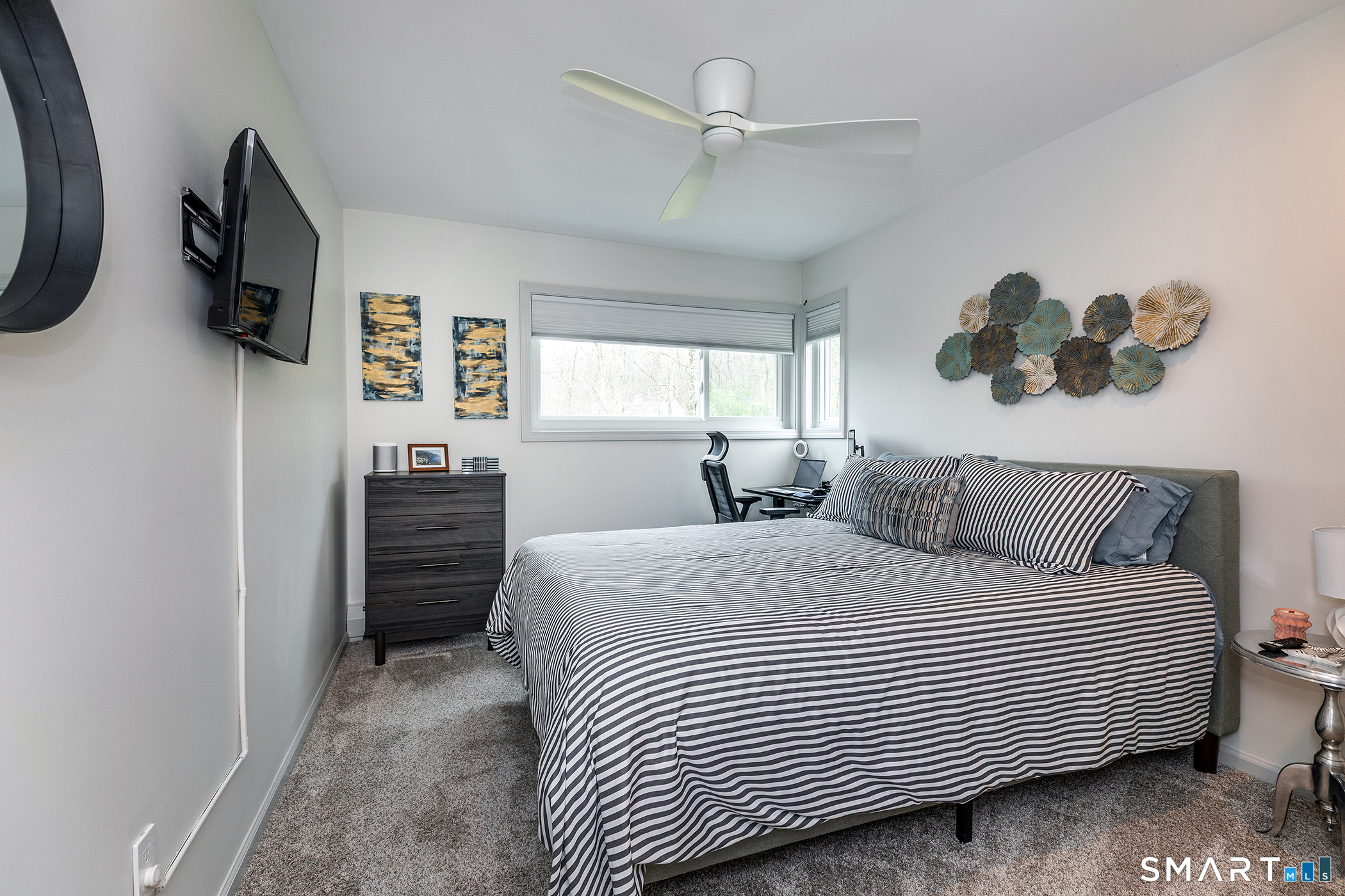 12 Silver Hill Road Sharon, CT 06069 - Photo 18 of 26 a bedroom with a bed and a flat tv screen on dresser