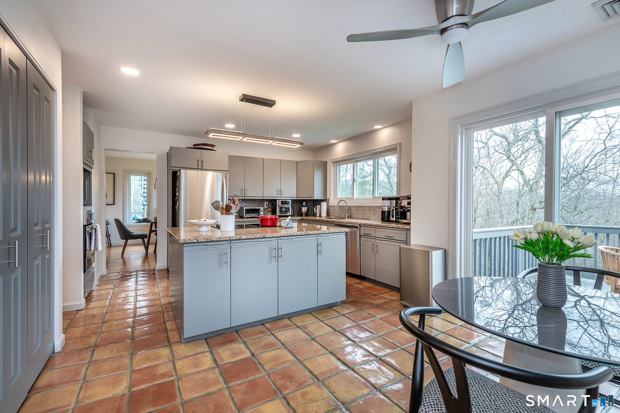 12 Silver Hill Road Sharon, CT 06069 - Photo 4 of 26 a kitchen with kitchen island a counter top space a sink stainless steel appliances and cabinets
