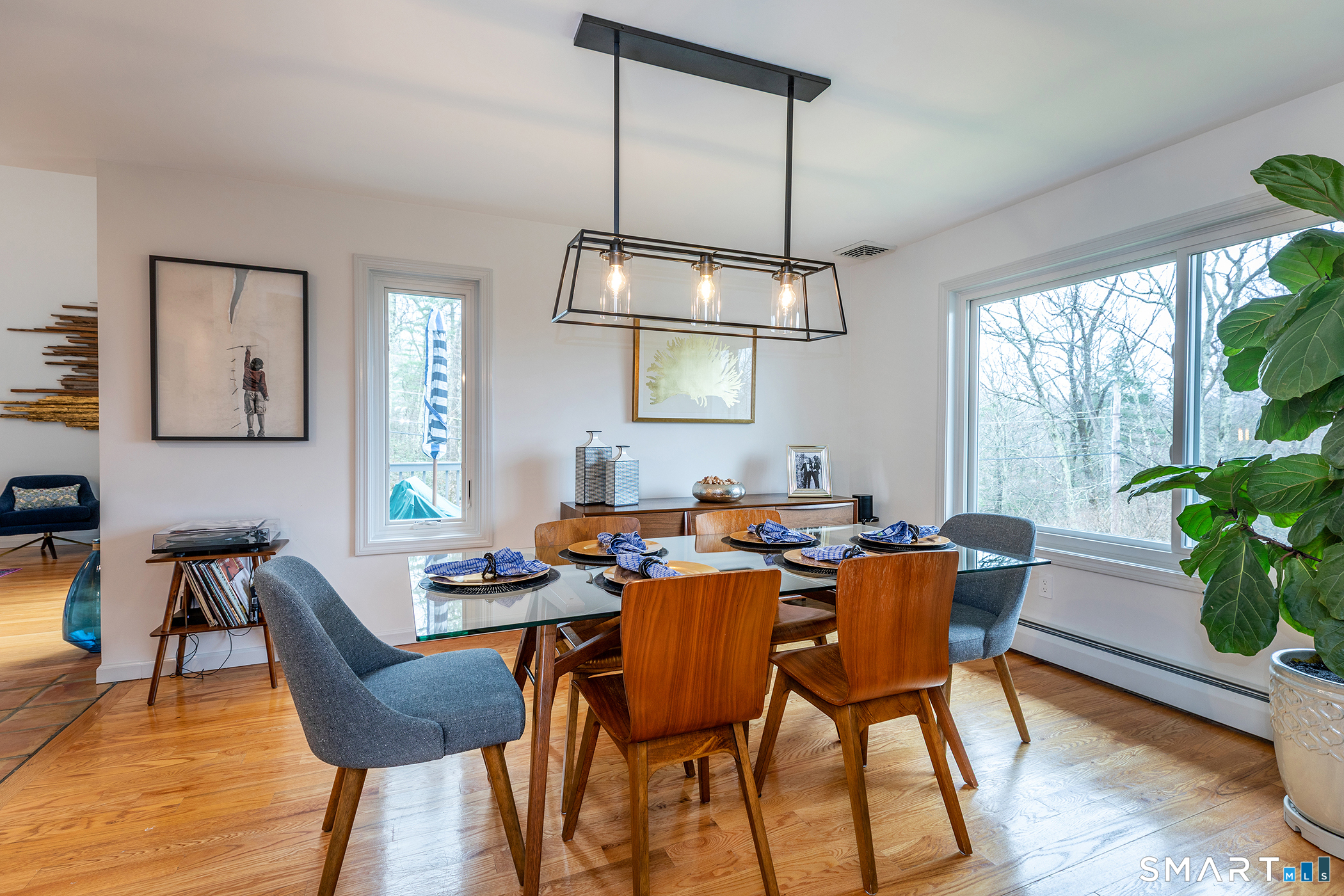 12 Silver Hill Road Sharon, CT 06069 - Photo 7 of 26 a dining room with furniture a chandelier and wooden floor