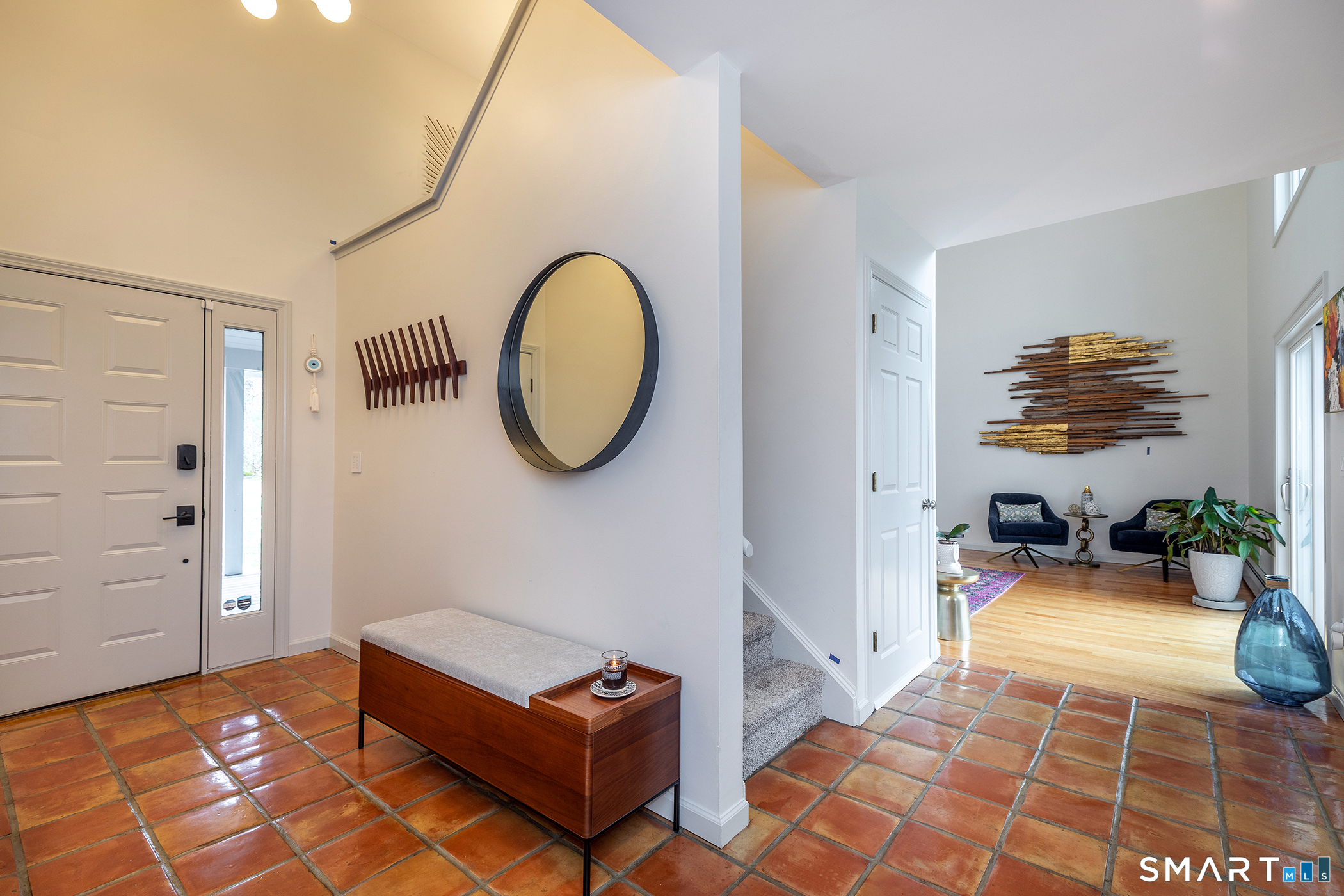 12 Silver Hill Road Sharon, CT 06069 - Photo 8 of 26 a living room with furniture a flat screen tv and a window