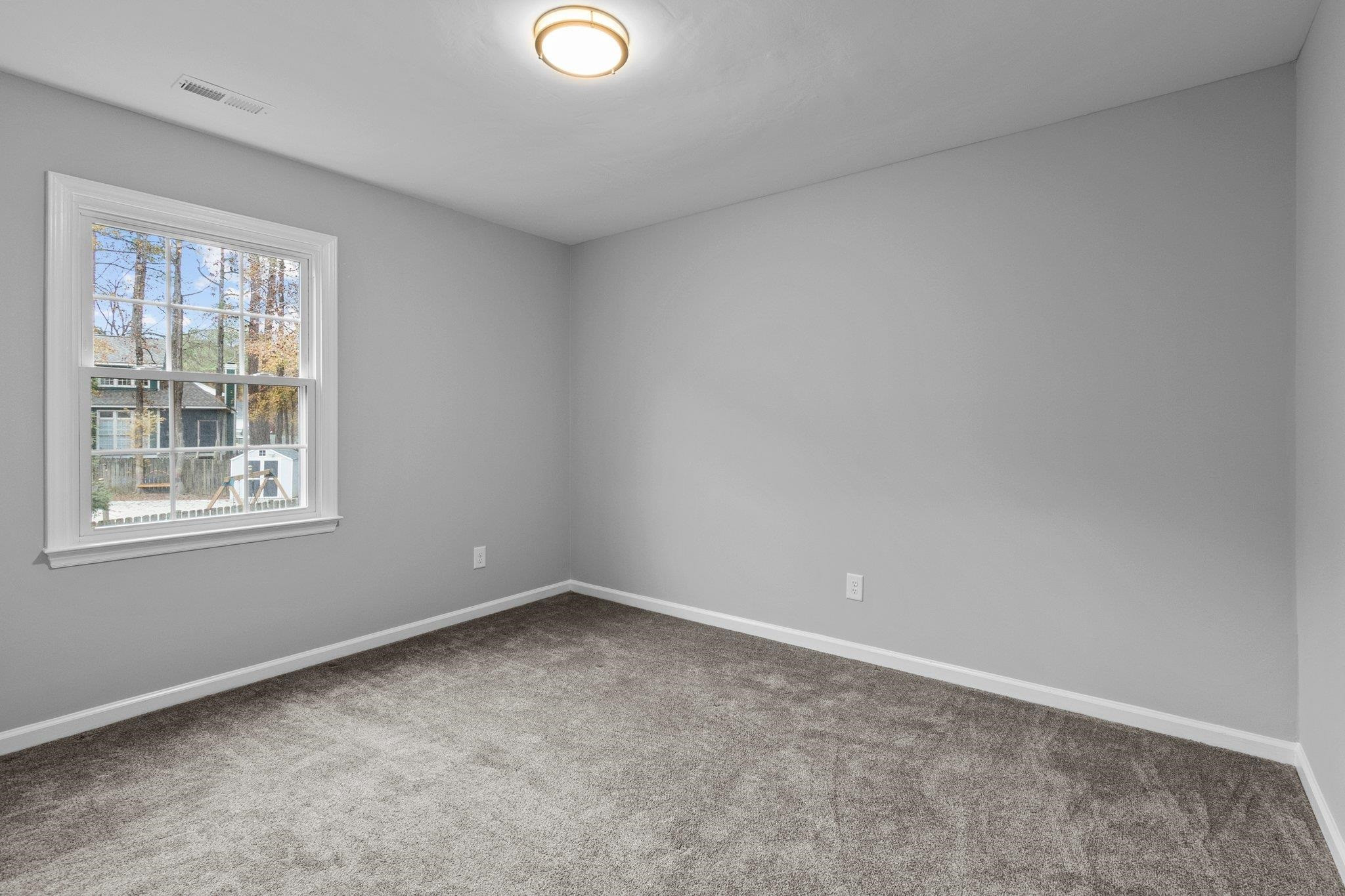 5616 Torness Court Raleigh, NC 27604 - Photo 24 of 37 Bedroom 2 has carpet, standard closet, and single window. Bedroom 2