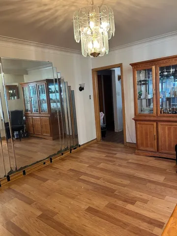 a view of a room with wooden floor and stairs