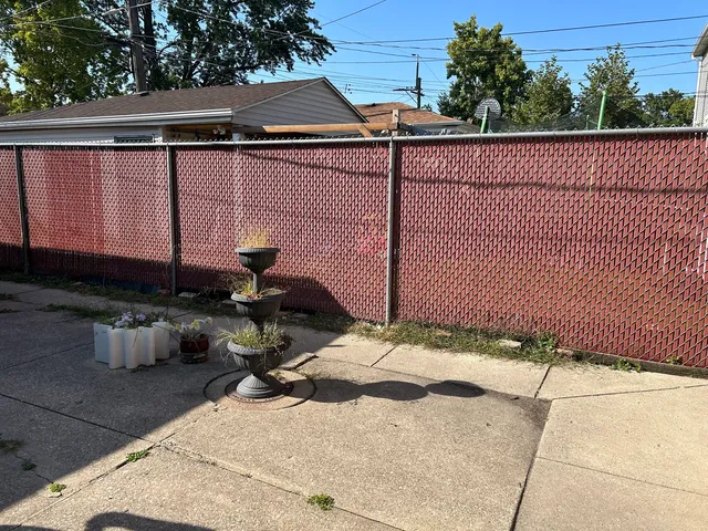 a backyard of a house with a yard and outdoor seating