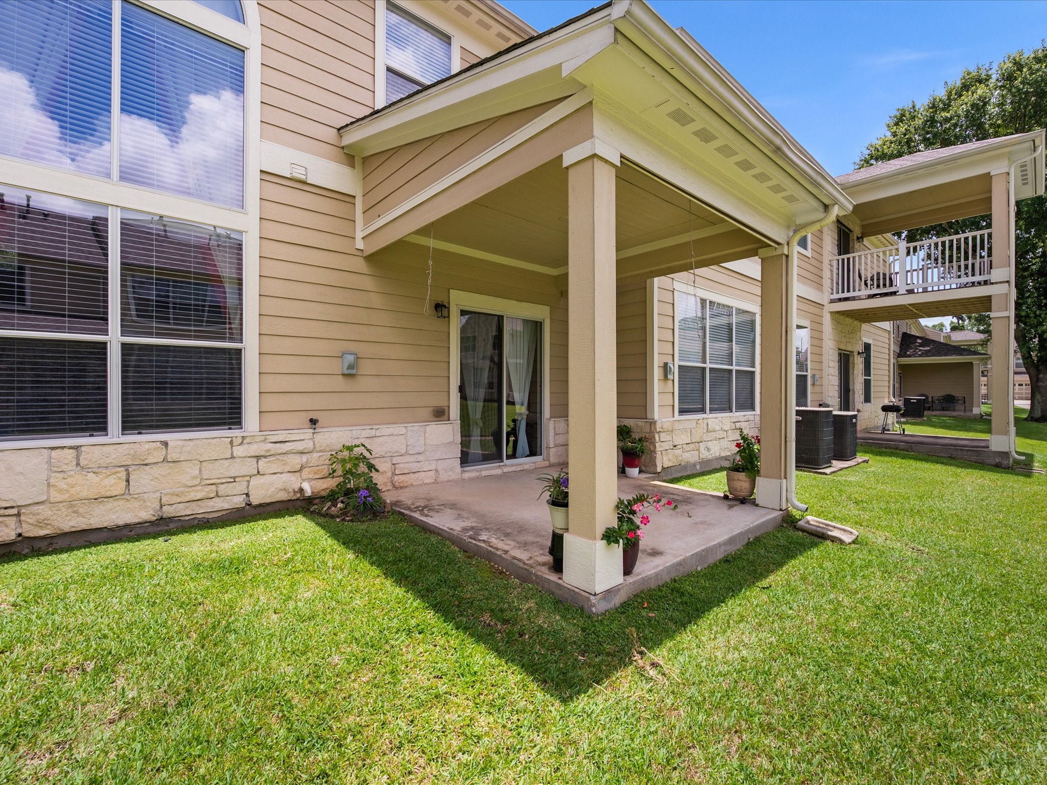 13600 Breton Ridge Street, Unit 31C Houston, TX 77070 - Photo 27 of 31 Whether enjoying your morning coffee or unwinding after a long day, the covered patio provides a low-maintenance outdoor space to enjoy year-round.