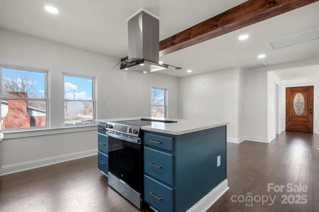 a kitchen with stainless steel appliances granite countertop a stove and a sink