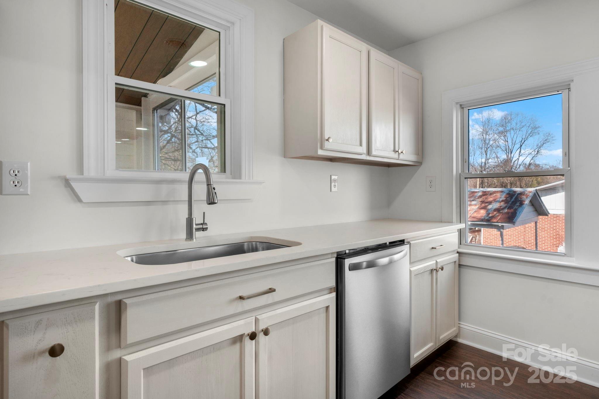 926 Fairview Drive Southwest Lenoir, NC 28645 - Photo 14 of 20 a kitchen with stainless steel appliances granite countertop a sink and a window