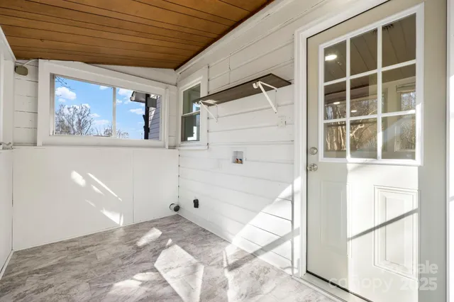 a view of a bedroom with a large window