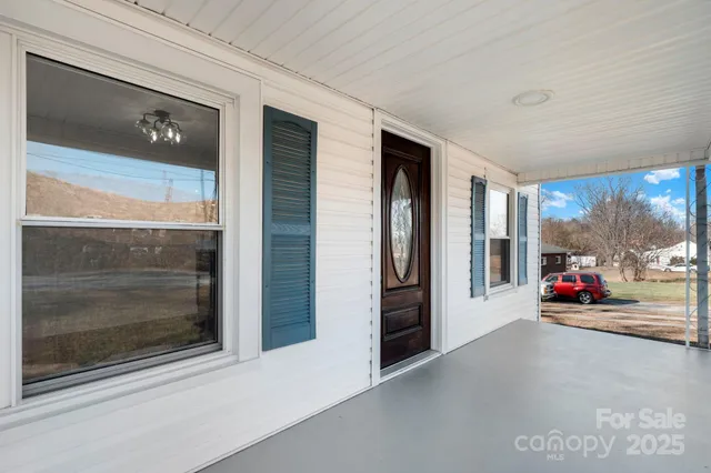 a view of a car garage door and a car parked in garage