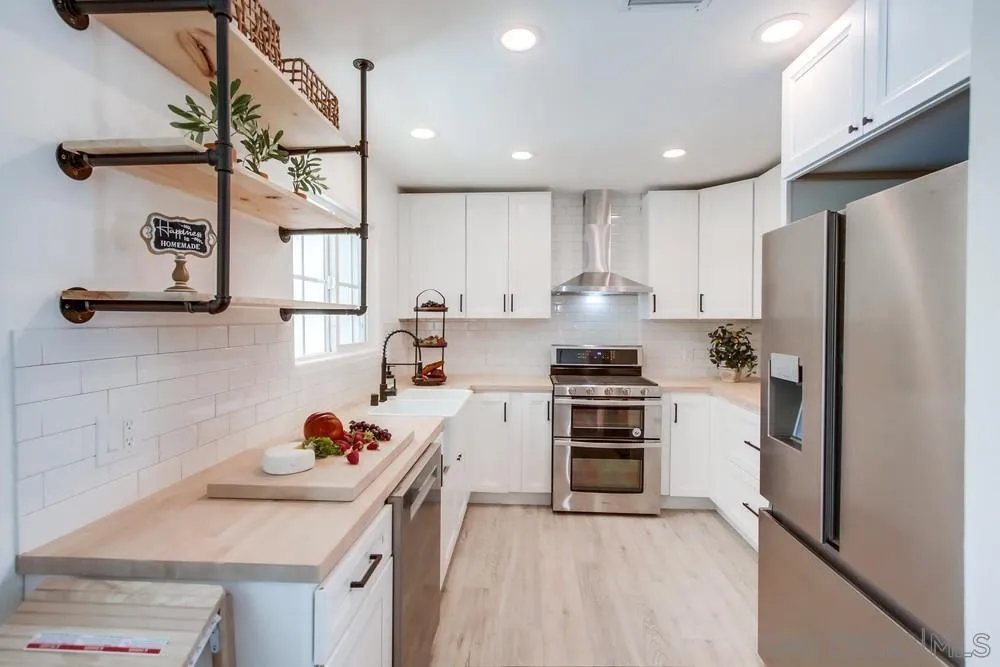9130 Hillman Way Lakeside, CA 92040 - Photo 20 of 48 a kitchen with a stove a refrigerator and a sink