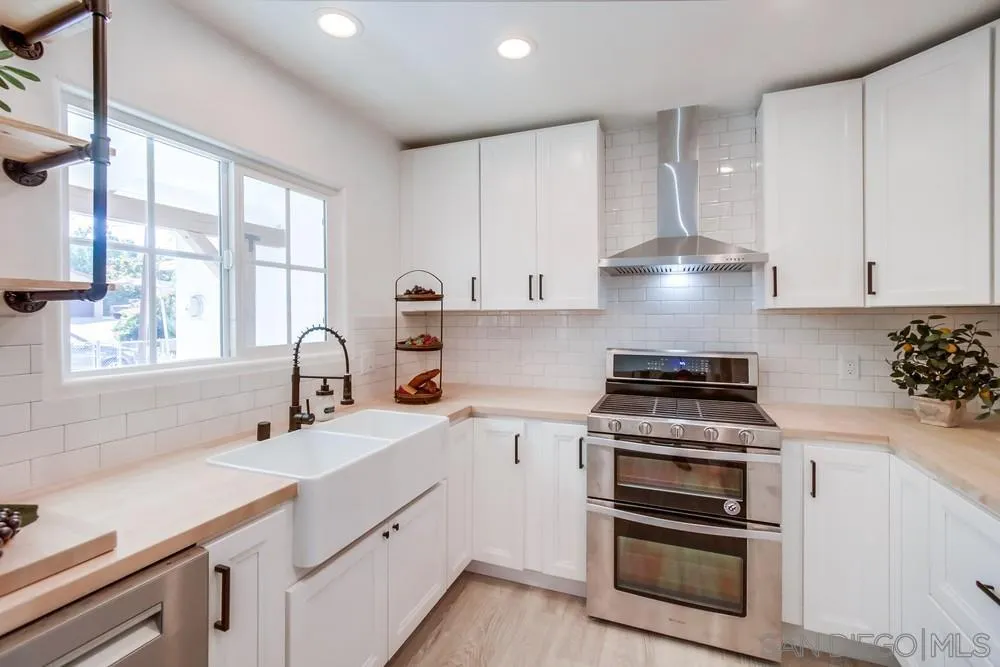 9130 Hillman Way Lakeside, CA 92040 - Photo 21 of 48 a kitchen with a stove oven and sink
