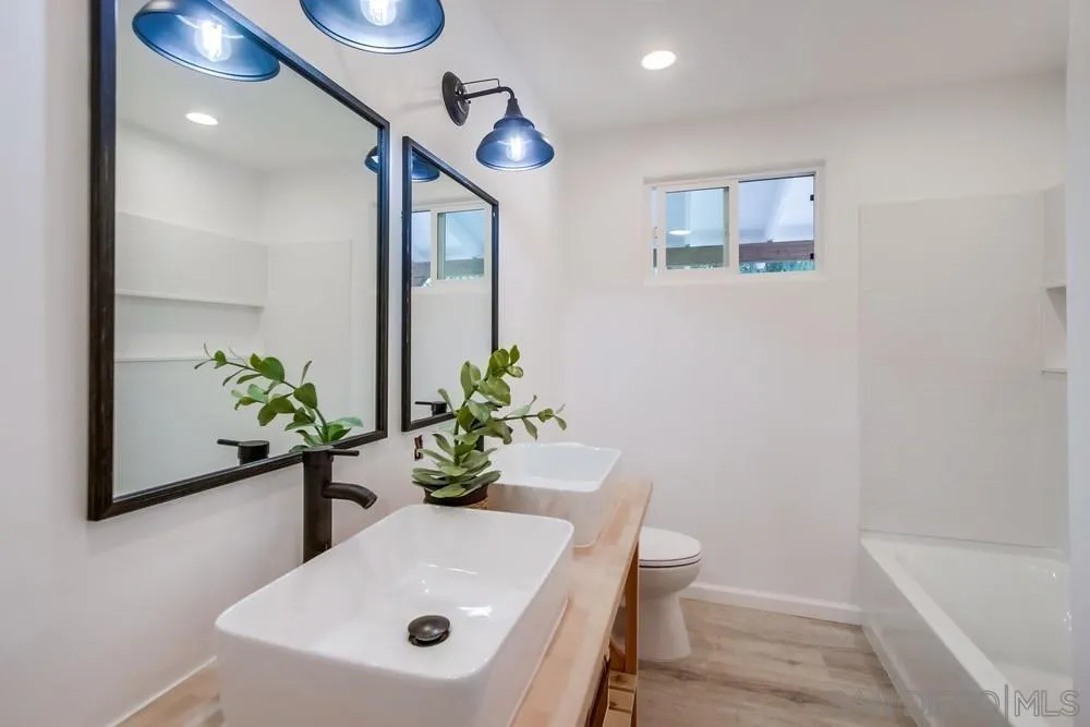 9130 Hillman Way Lakeside, CA 92040 - Photo 25 of 48 a bathroom with a sink a toilet and a bathtub