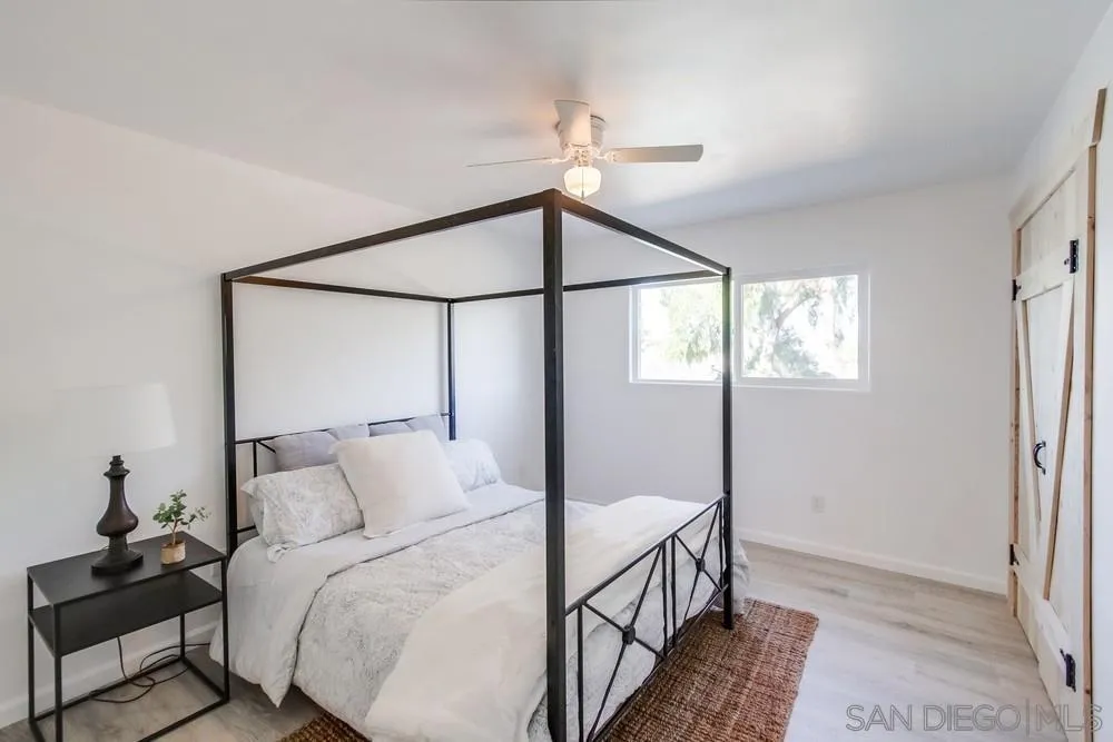 9130 Hillman Way Lakeside, CA 92040 - Photo 27 of 48 a bedroom with a bed and a mirror