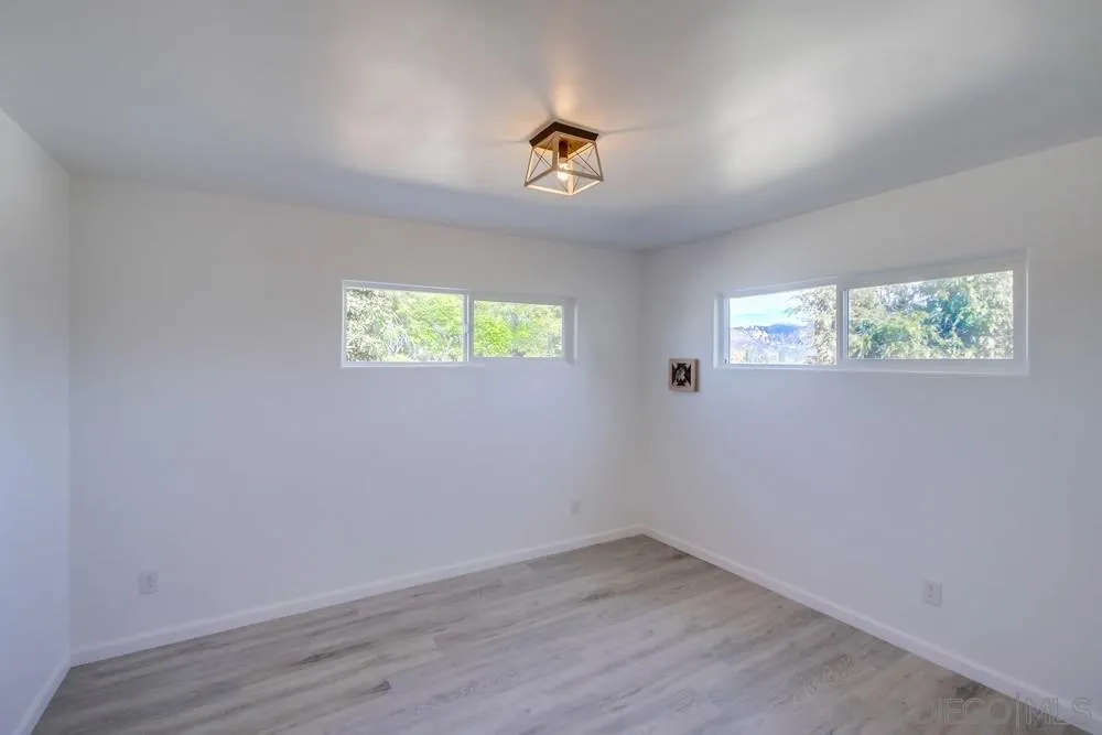 9130 Hillman Way Lakeside, CA 92040 - Photo 29 of 48 wooden floor in an empty room with a window