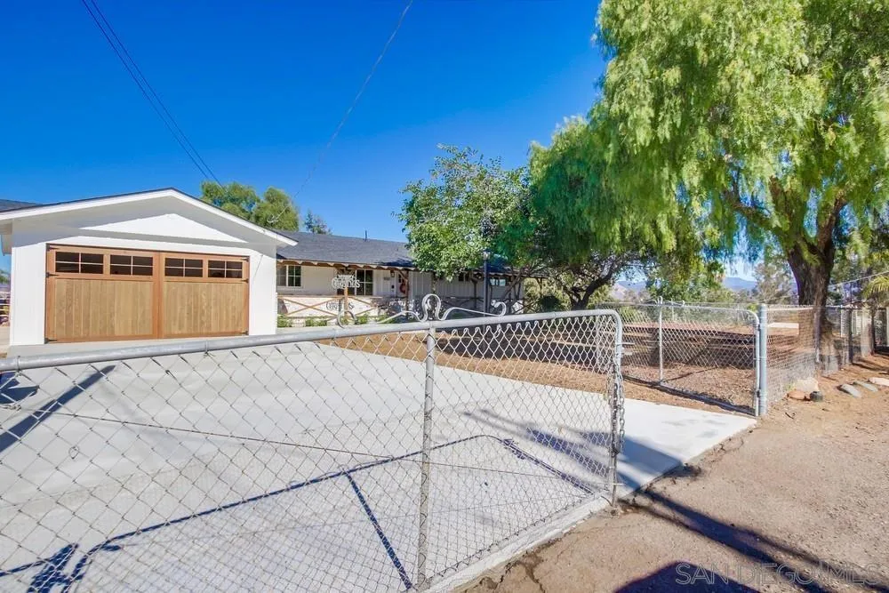 9130 Hillman Way Lakeside, CA 92040 - Photo 3 of 48 a view of a house with a backyard