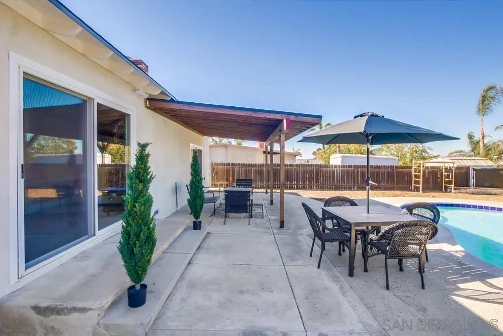 9130 Hillman Way Lakeside, CA 92040 - Photo 36 of 48 a patio with a patio table and chairs