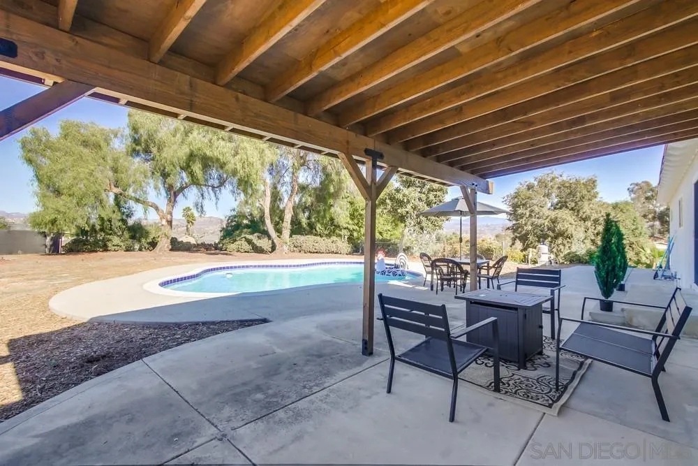 9130 Hillman Way Lakeside, CA 92040 - Photo 37 of 48 a view of a patio with table and chairs and potted plants