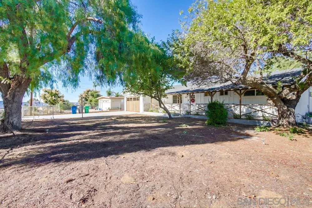 9130 Hillman Way Lakeside, CA 92040 - Photo 4 of 48 a view of street along with house and trees