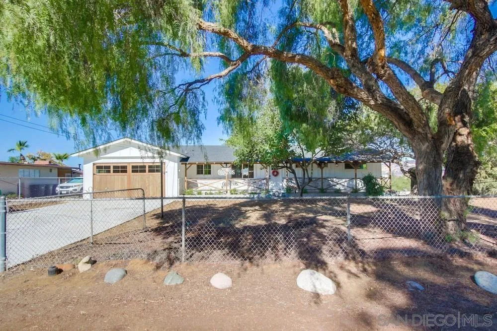 9130 Hillman Way Lakeside, CA 92040 - Photo 48 of 48 a backyard of a house with barbeque oven table and chairs