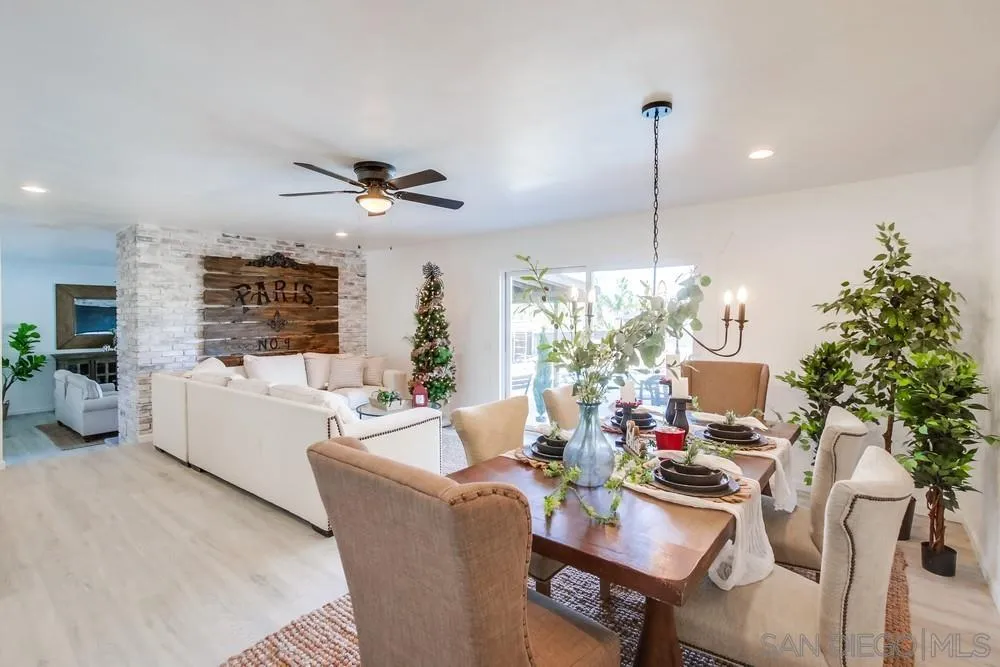 9130 Hillman Way Lakeside, CA 92040 - Photo 9 of 48 a living room with furniture chandelier and a large window