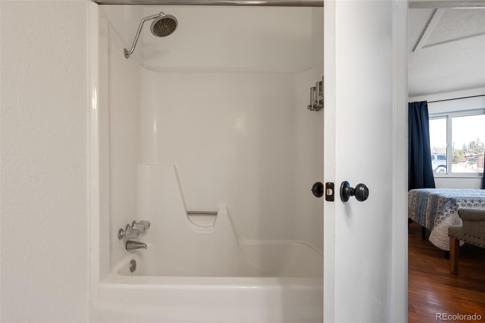 105 County Road, Unit 20 Grand Lake, CO 80447 - Photo 13 of 16 a bathroom with a bathtub