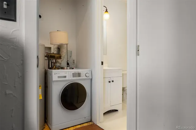 a view of a hallway with washer and dryer