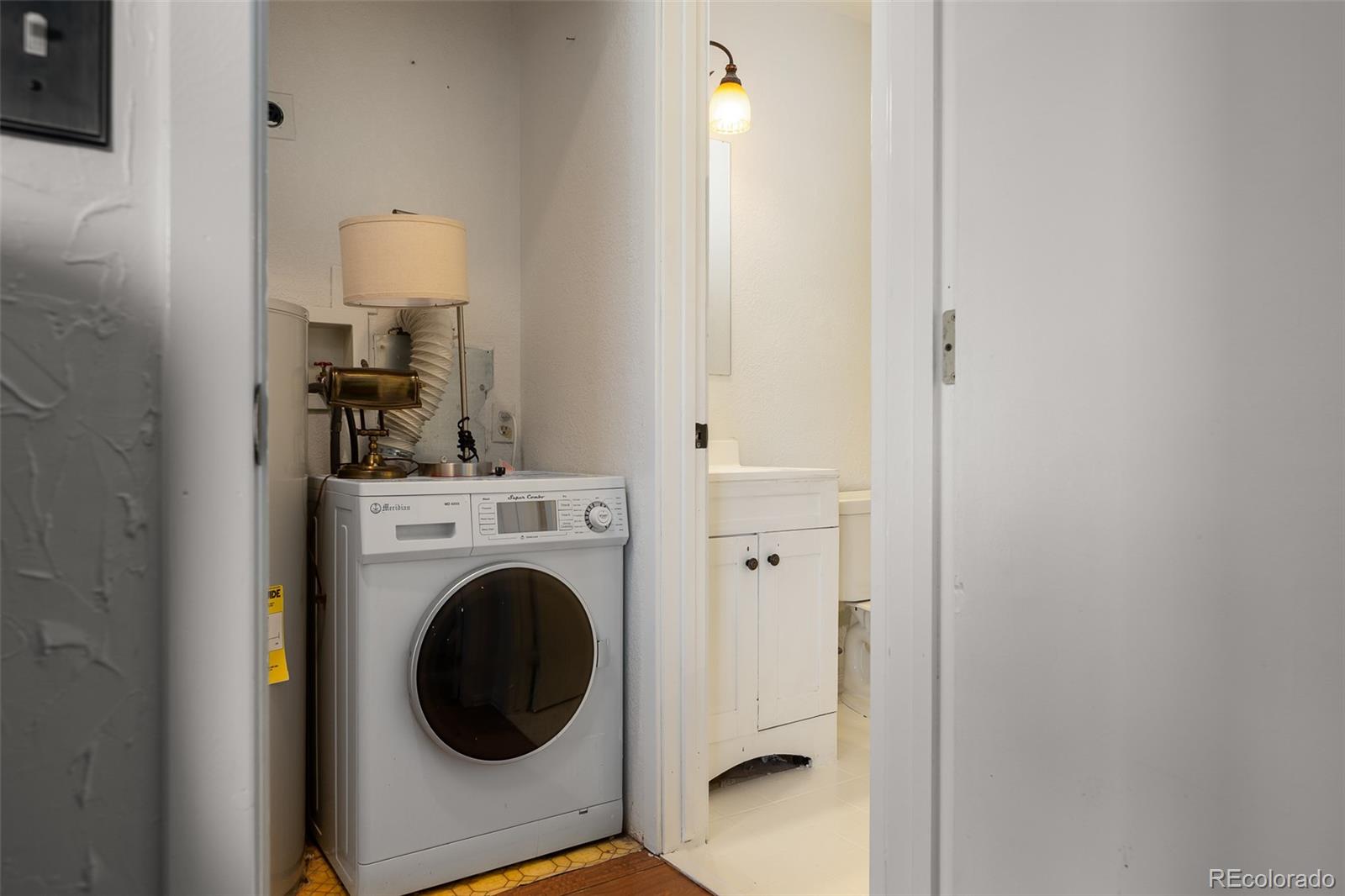 105 County Road, Unit 20 Grand Lake, CO 80447 - Photo 14 of 16 a view of a hallway with washer and dryer