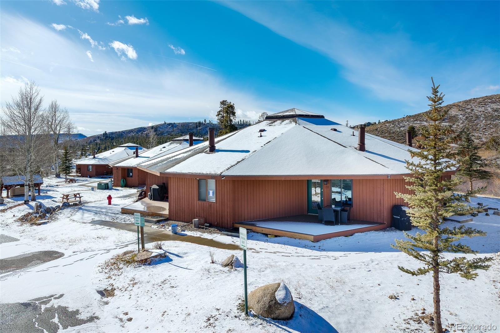 105 County Road, Unit 20 Grand Lake, CO 80447 - Photo 15 of 16 a view of a backyard with sitting area