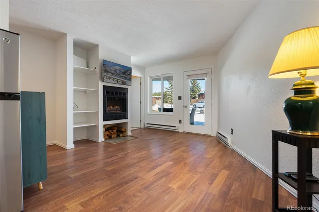a view of a livingroom with furniture and a flat screen tv
