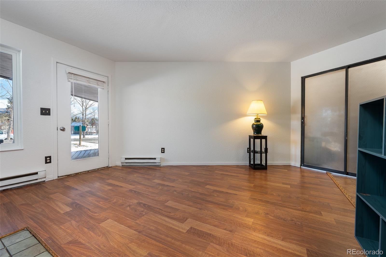 105 County Road, Unit 20 Grand Lake, CO 80447 - Photo 6 of 16 a view of empty room with wooden floor and window