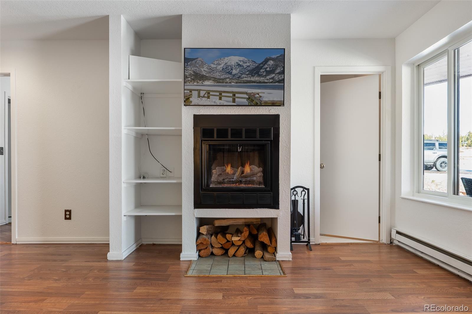 105 County Road, Unit 20 Grand Lake, CO 80447 - Photo 8 of 16 a living room with furniture and a fireplace