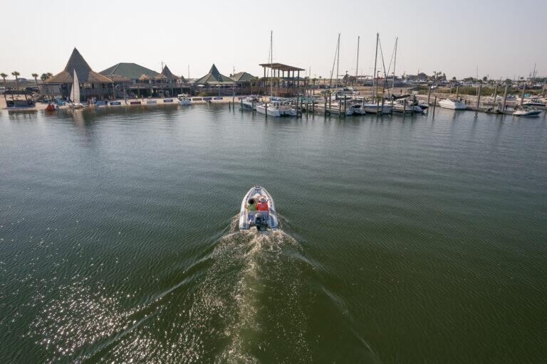 2825 Teepee Road Navarre, FL 32566 - Photo 11 of 12 a view of a lake with boats and trees in the background