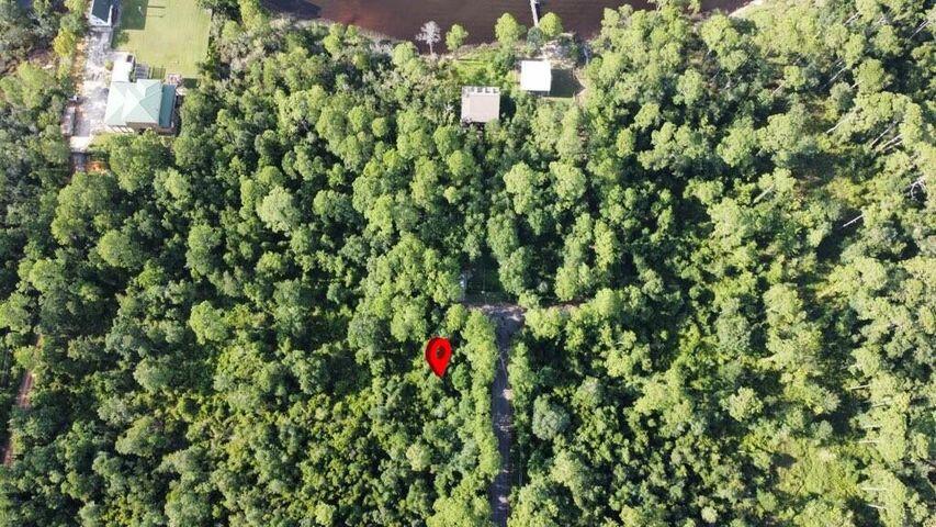 2825 Teepee Road Navarre, FL 32566 - Photo 2 of 12 a backyard of a house with lots of green space