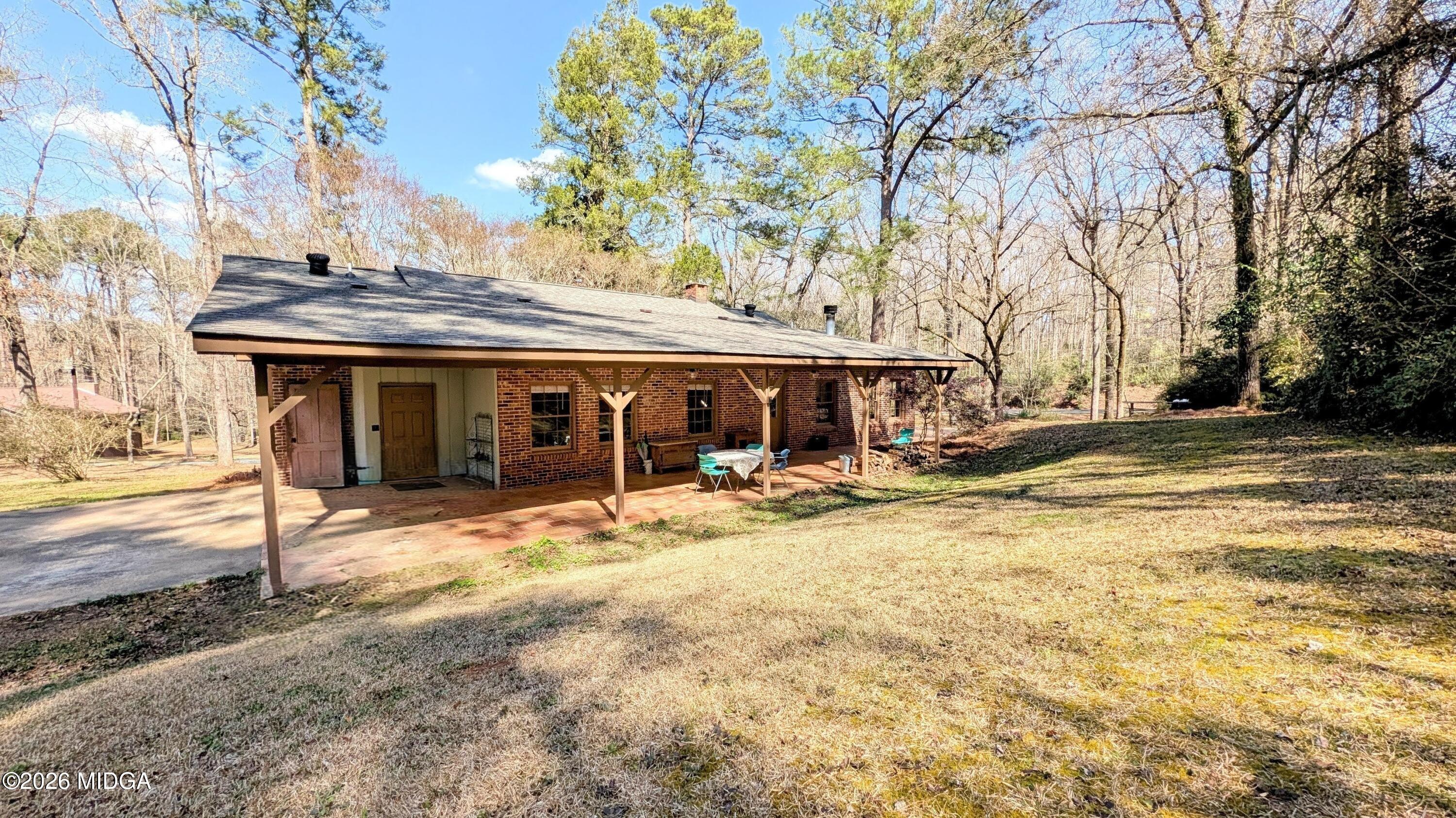 1068 Lamar Road Macon, GA 31210 - Photo 20 of 39 a front view of a house with a yard and garage