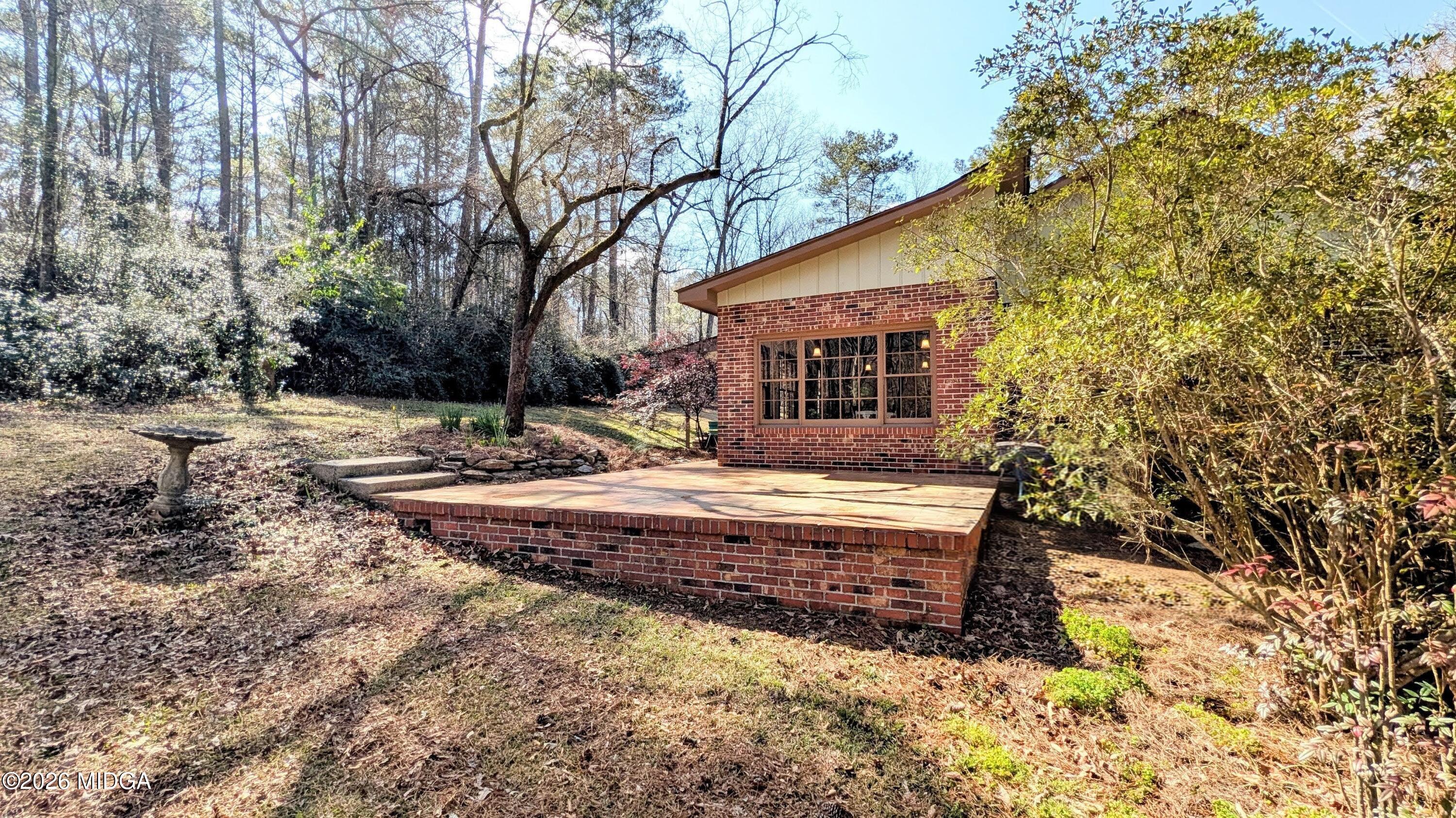 1068 Lamar Road Macon, GA 31210 - Photo 21 of 39 a view of a house with backyard and trees