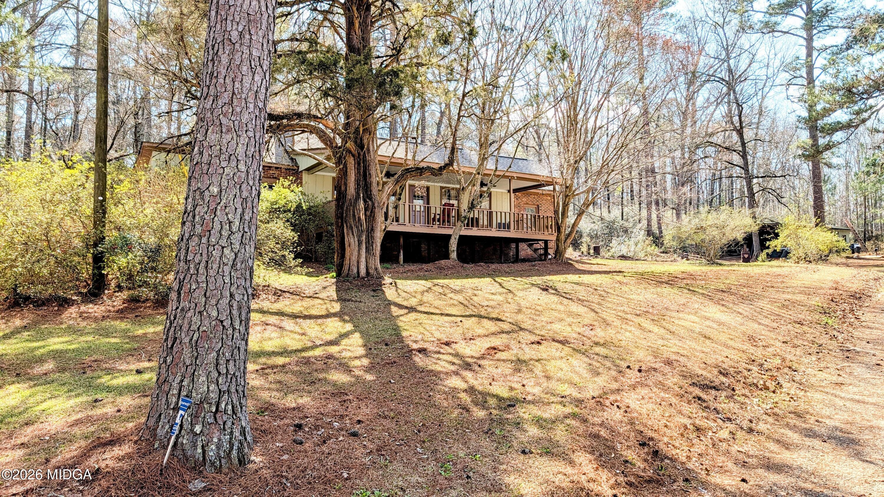 1068 Lamar Road Macon, GA 31210 - Photo 24 of 39 a front view of a house with a yard