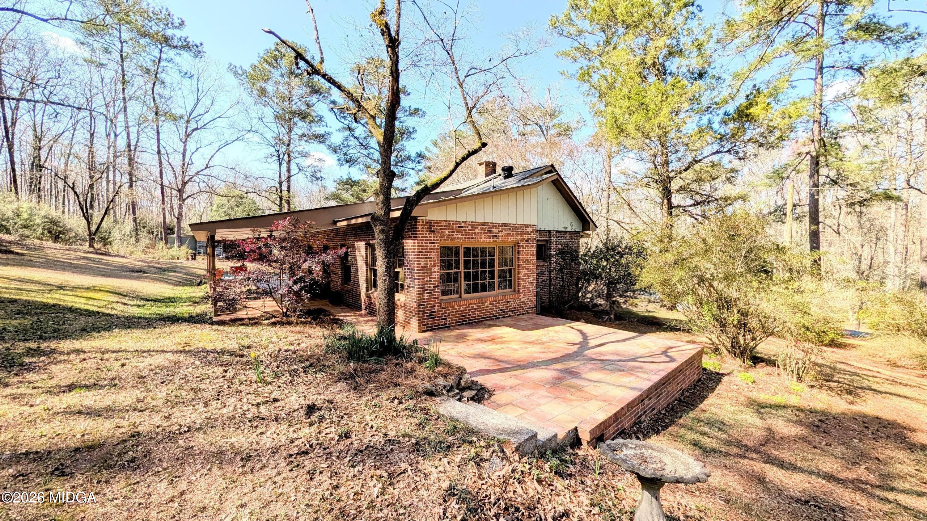 1068 Lamar Road Macon, GA 31210 - Photo 3 of 39 a view of a house with a yard covered in snow