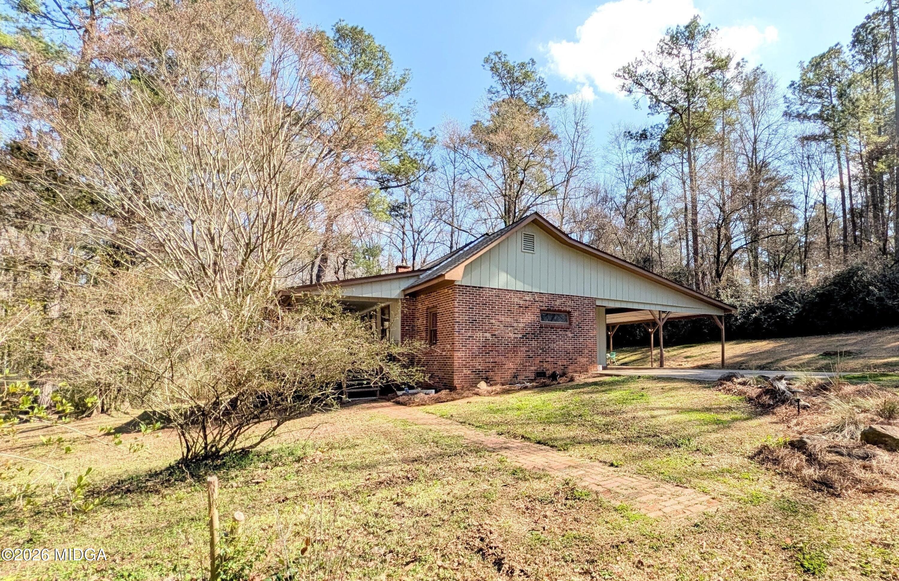 1068 Lamar Road Macon, GA 31210 - Photo 4 of 39 a view of a house with snow on the background