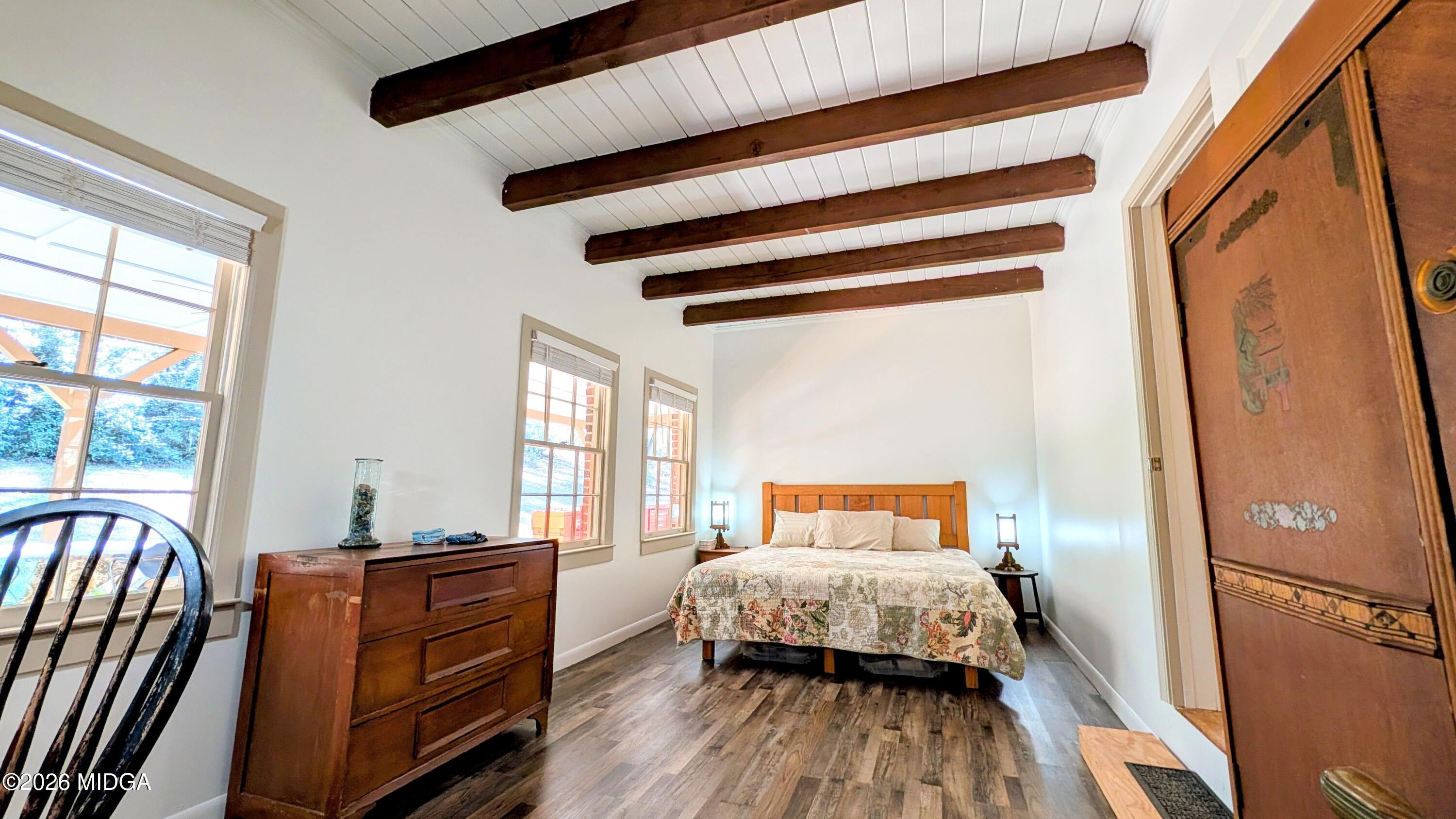 1068 Lamar Road Macon, GA 31210 - Photo 9 of 39 a bedroom with a bed and wooden floor