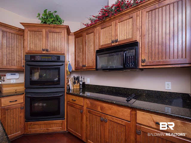 9380 Greenleaf Drive Daphne, AL 36527 - Photo 12 of 24 Gourmet Kitchen with breakfast bar, breakfast nook, cook top, double ovens, and tons of prep and storage space!