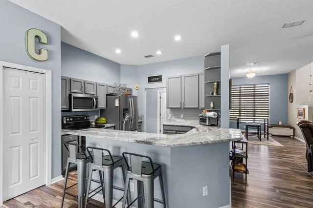 a kitchen with a sink and wooden cabinets