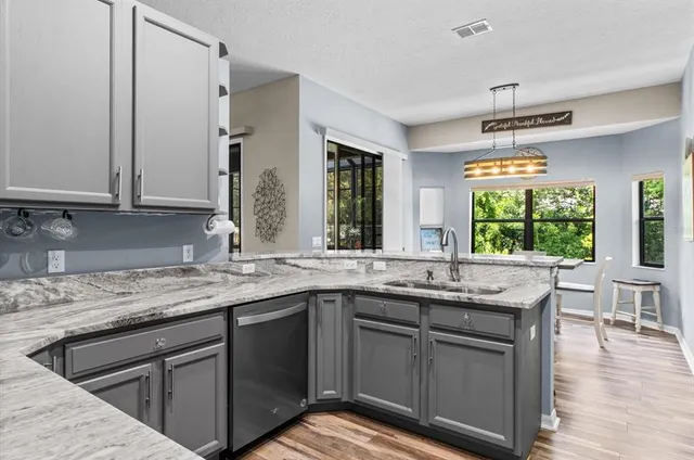 a kitchen with stainless steel appliances a refrigerator stove and microwave