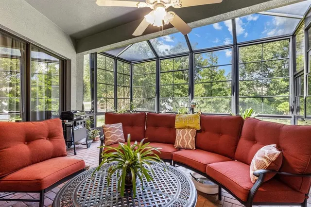 a outdoor patio with chairs and a table
