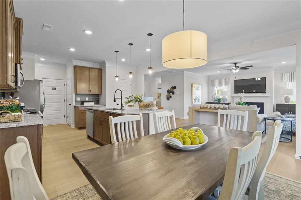 156 Saddle Ridge Trail Jasper, GA 30143 - Photo 12 of 45 a kitchen with stainless steel appliances granite countertop a stove a refrigerator a kitchen island a stove and white cabinets