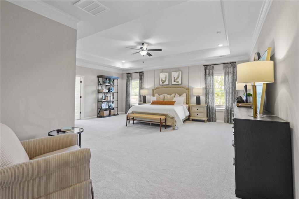 156 Saddle Ridge Trail Jasper, GA 30143 - Photo 25 of 45 a bed room with furniture and a chandelier