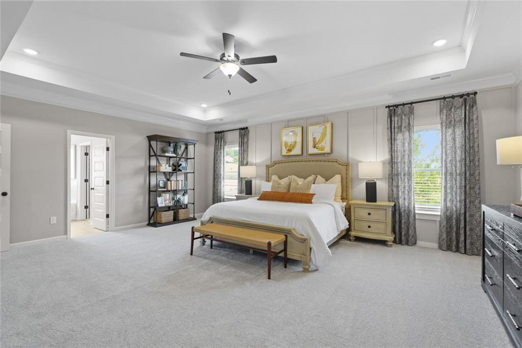 156 Saddle Ridge Trail Jasper, GA 30143 - Photo 26 of 45 a bedroom with a bed and a chandelier