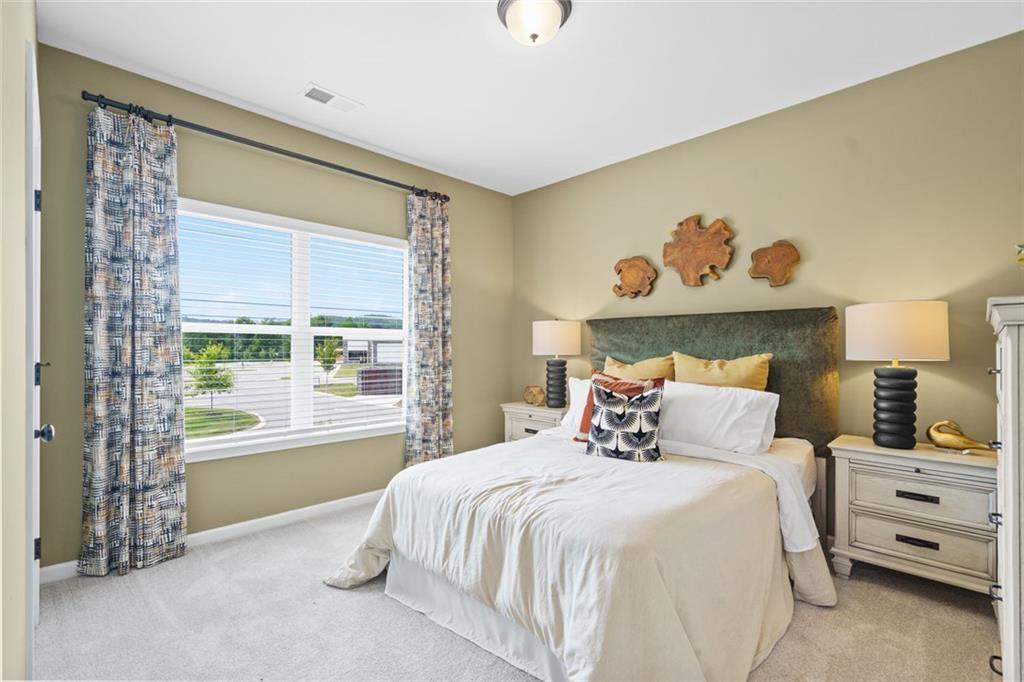 156 Saddle Ridge Trail Jasper, GA 30143 - Photo 36 of 45 a bedroom with a bed and a window