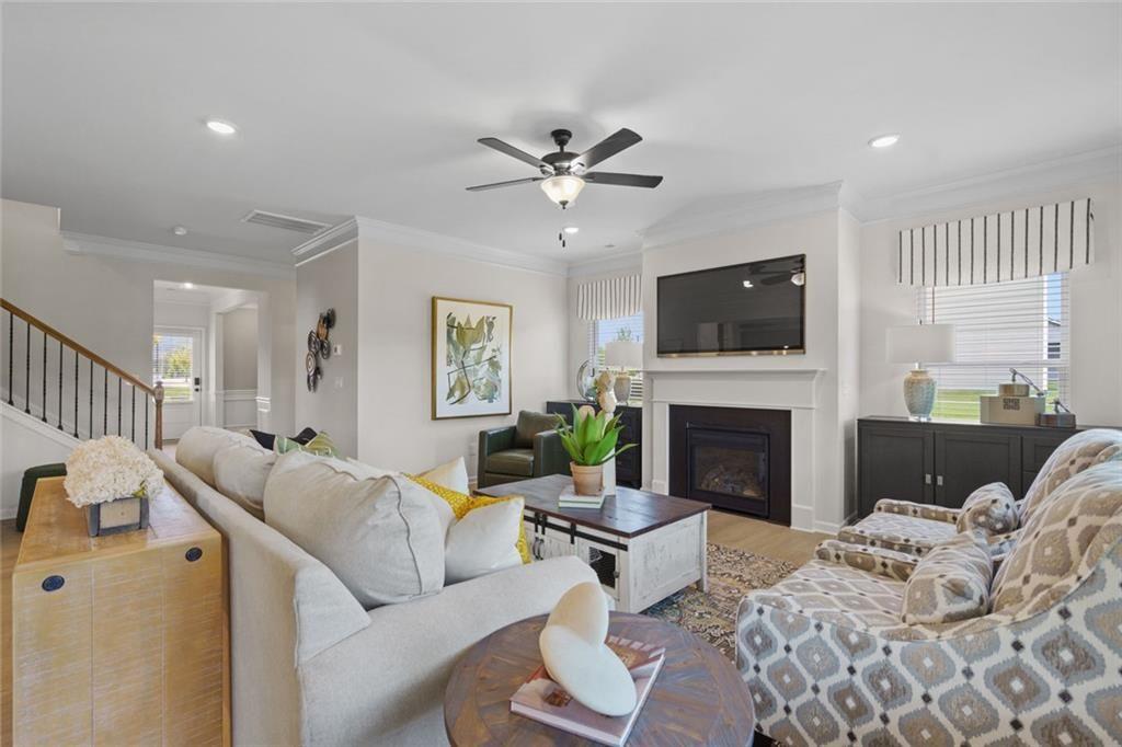 156 Saddle Ridge Trail Jasper, GA 30143 - Photo 6 of 45 a living room with furniture a fireplace and a flat screen tv